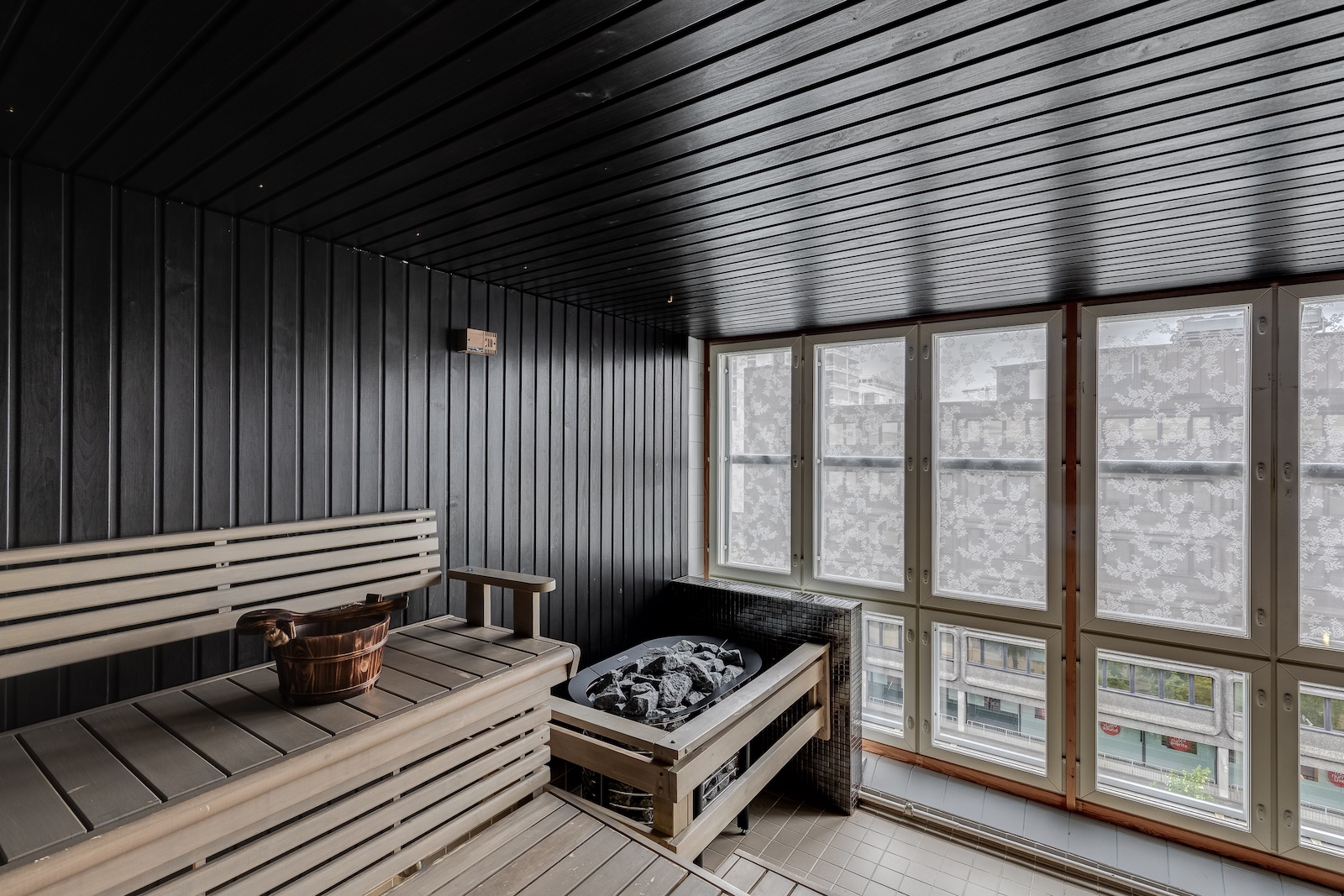 Sauna — black panels and large windows