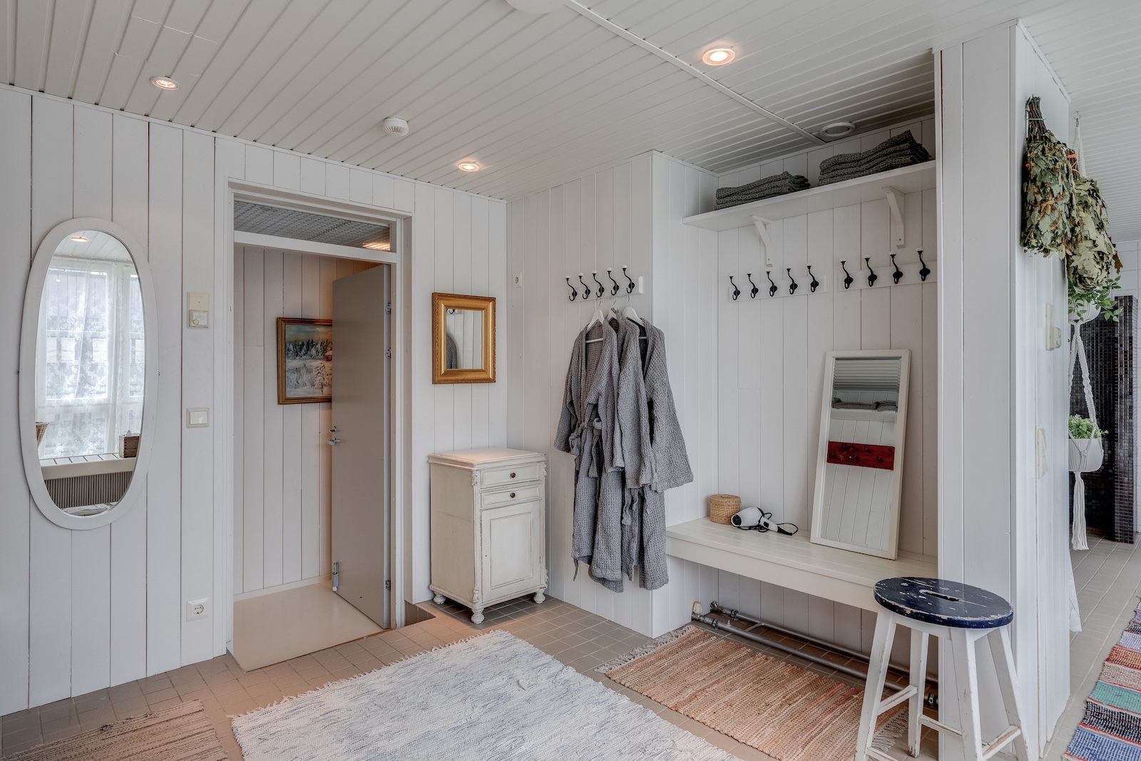 Changing room detail — mirror and birch whisks